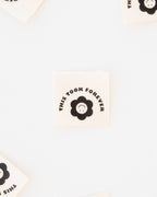 Flower "This Took Forever" Black and White Organic Cotton Sewing Labels - 3cm x 3cm