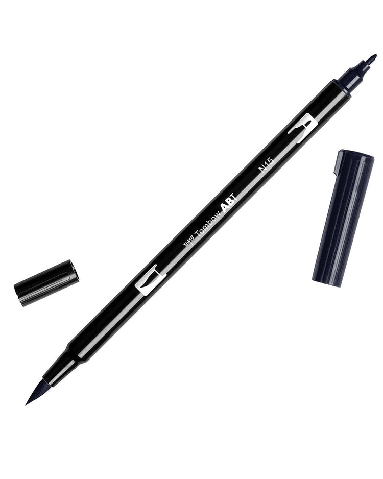 A black n15 dual sided tombow pen.  One side is a brush pen and the other side a normal thin marker pen.  The caps are off on both sides of the pen.