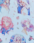 a close up of pink foiled paper stickers featuring pink and blue haired women