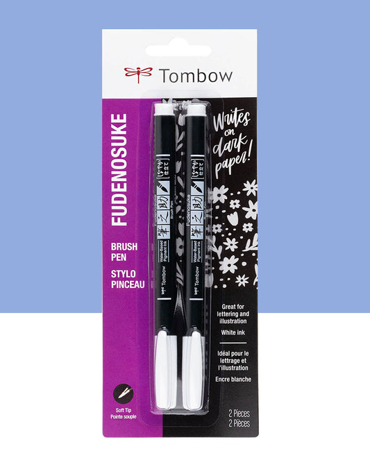 A set of two fudenosuke white ink brush pens by tombow with soft tips in its packaging with a purple and white background.