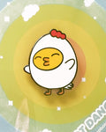 A little yellow ducky dressed up as grumpy chicken and enamel pin using the colors yellow, red, and white. Designed by small business robot dance battle