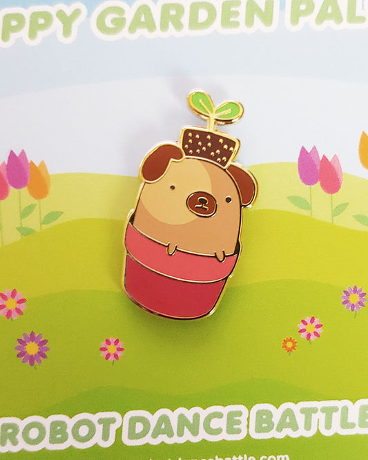 A cute kawaii pug dog with a de-potted plant on its head.  It's hiding/sitting in a pink plant pot.  A hard enamel lapel pin.
