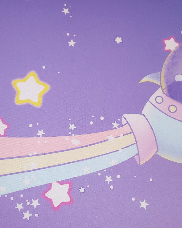 A pastel pink yellow, and blue rainbow trails behind and pastel yellow, pink, and blue spaceship.  There are small white stars as well as big white stars outlined in hot pink and other in yellow.