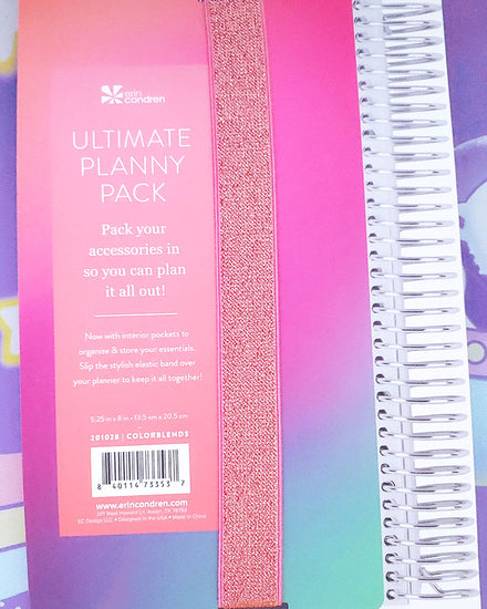 A coral, pink, purple, blue, and green ombre backing that reads "ultimate planny pack".  A gold and sparkly elastic band runs own the middle.  It also reads "pack your accessories in so you can plan it all out!"
