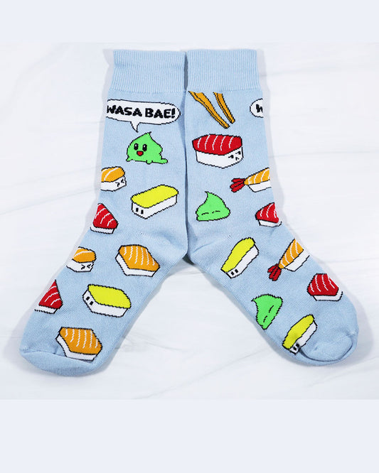 Red, orange, yellow, and white sashimi socks with a little green wasabi pile that says "wasa bae" on light blue socks. In men and women sizes.. Designed by Emii Creations