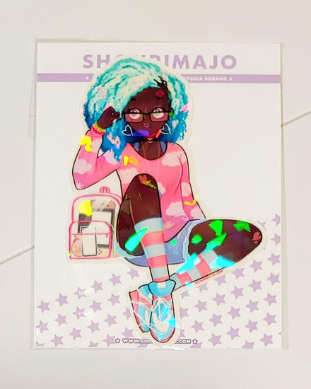 An african american girl with blue ombre hair, glasses, and purple eyes.  She has heart dangle earrings, and a pink cloud ombre long sleeve tshirt.  She has a pink and clear backpack with handheld gaming consoles inside.  She is also wearing light blue and pink striped socks and blue and pink cross traines.  She has three bracelets and her hand is by her head.  She is in a sitting position.  All of this kawaii manga digital art is printed on a broken glass holographic vinyl sticker with a white border.