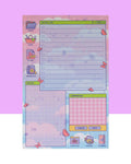 A pink, blue, purple, and green daily planner notepad with 50 non-sticky sheets featuring a windows desktop feel. It's both a computer style layout and picnic at the park feel. It has a file folder, picnic basket, planes file document, and camera on the left side. There are areas for a to do list, your notes, and things for tomorrow. At the bottom there is a folder that reads supplies, a pitcher that reads drinks, and a book that reads journal.