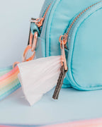 The blue bag that goes with the build-your-own crossbody features gold-toned zippers and details w/black weaved zipper tags. This photo shows how you can use the two compartmented bag as a waste bag holder if you do not wish to buy one separately.