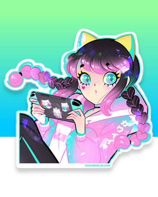 A pink and black gradient/ombre haired girl with pigtails and a pink, white, and blue pastel track jacket and black and blue track pants sits and leans back while playing her blue and black nintendo switch that is covered in kitty cat stickers.  She has blue and yellow cat ears on and yellow eyeshadow her eyes sparkle. All of this digital art piece is printed on a broken glass holographic vinyl sticker.